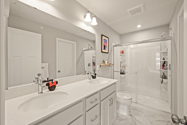 full bathroom featuring a stall shower, double vanity, a sink, and visible vents