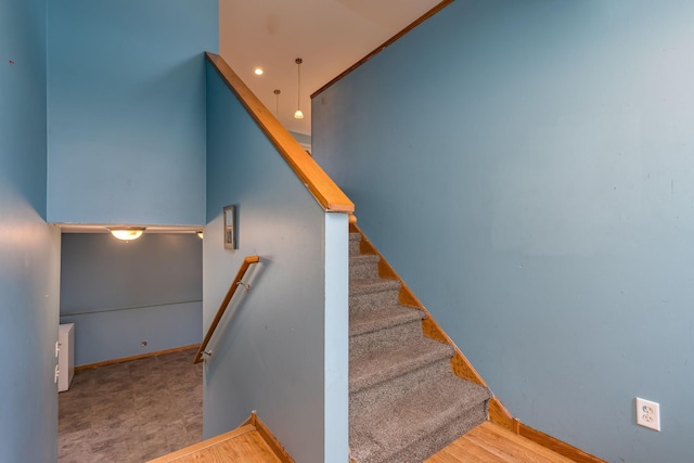stairway featuring baseboards
