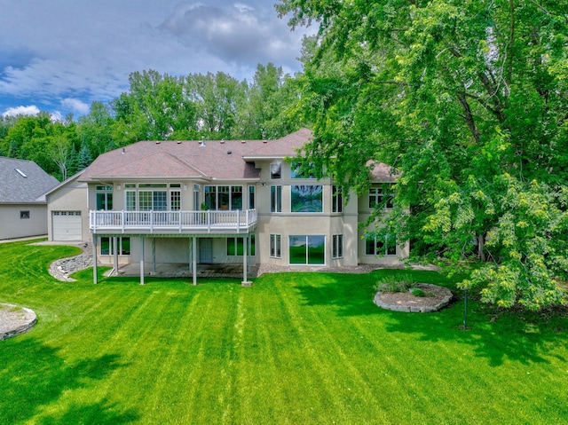 926 Kohlman Ln, Maplewood, MN 55109 - rear view of house with stucco siding, a yard, and a deck