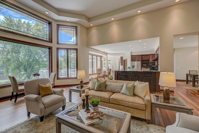 926 Kohlman Ln, Maplewood, MN 55109 - living area featuring a towering ceiling, recessed lighting, and light wood finished floors
