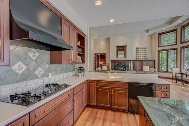 926 Kohlman Ln, Maplewood, MN 55109 - kitchen featuring black appliances, ventilation hood, tasteful backsplash, brown cabinetry, and recessed lighting