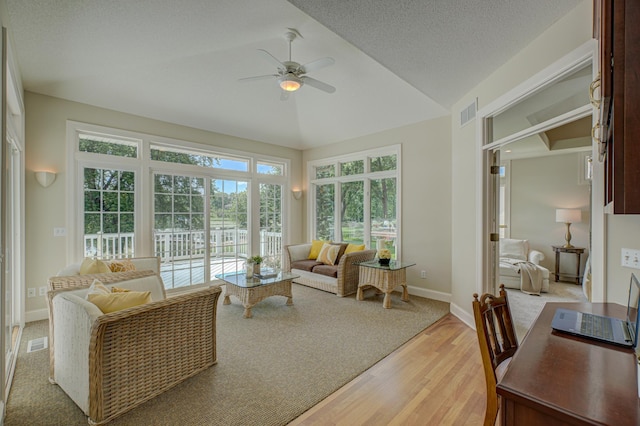 926 Kohlman Ln, Maplewood, MN 55109 - living room with light wood finished floors, ceiling fan, and lofted ceiling