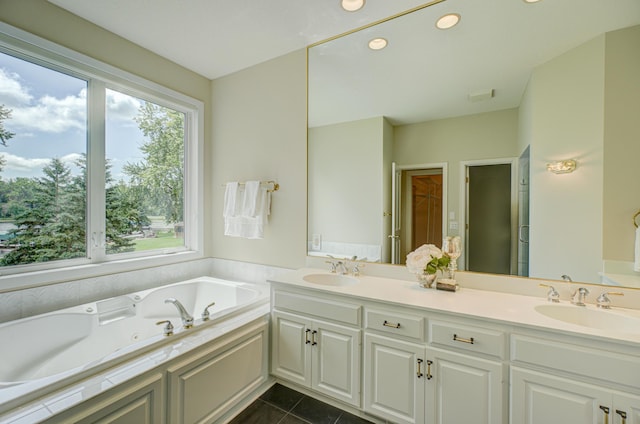 926 Kohlman Ln, Maplewood, MN 55109 - bathroom with double vanity, a whirlpool tub, recessed lighting, and tile patterned floors