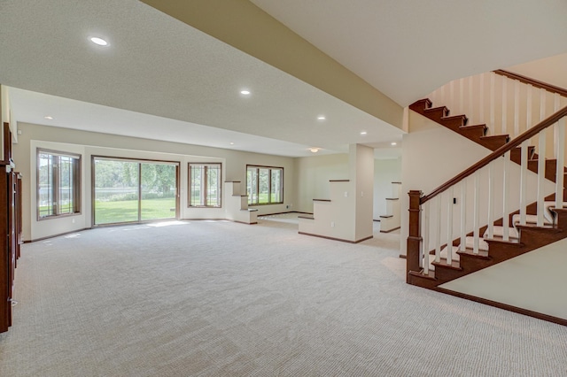 926 Kohlman Ln, Maplewood, MN 55109 - unfurnished living room with carpet flooring, recessed lighting, and stairs