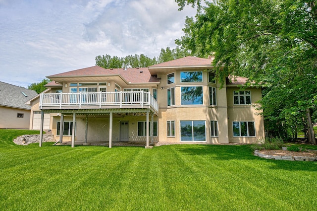926 Kohlman Ln, Maplewood, MN 55109 - back of house featuring stucco siding, a deck, and a yard
