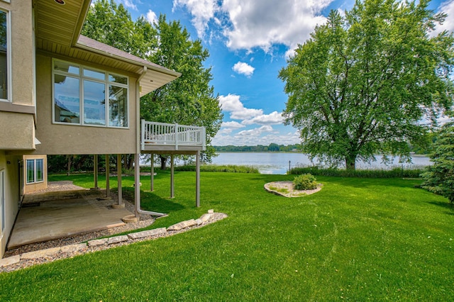 926 Kohlman Ln, Maplewood, MN 55109 - view of green lawn with a patio and a deck with water view