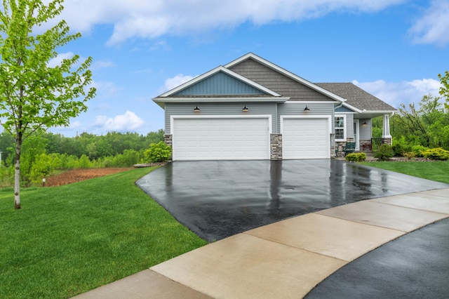 9769 Jeremiah Ct NE, Hanover, MN 55341 - view of front facade featuring asphalt driveway, a front lawn, stone siding, and an attached garage