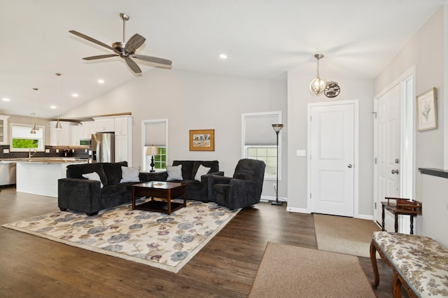 9769 Jeremiah Ct NE, Hanover, MN 55341 - living area with lofted ceiling, dark wood-style flooring, healthy amount of natural light, a ceiling fan, and recessed lighting