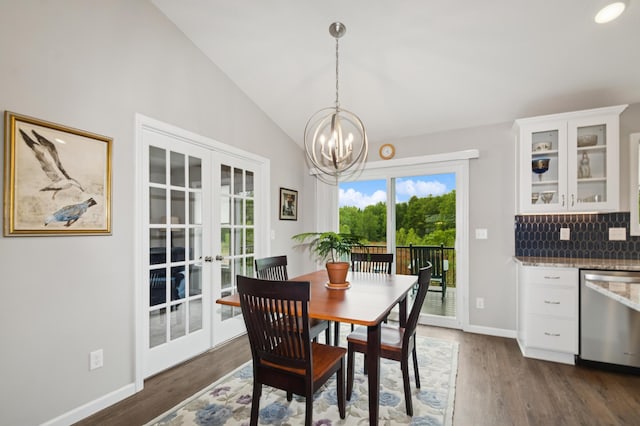 9769 Jeremiah Ct NE, Hanover, MN 55341 - dining space with a chandelier, vaulted ceiling, dark wood-style flooring, baseboards, and french doors