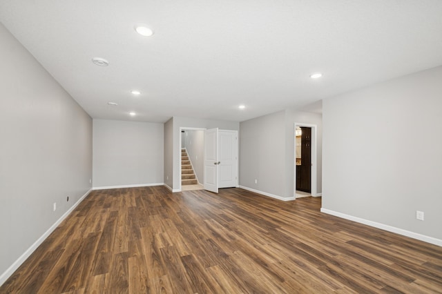9769 Jeremiah Ct NE, Hanover, MN 55341 - empty room featuring recessed lighting, dark wood-style floors, baseboards, and stairs
