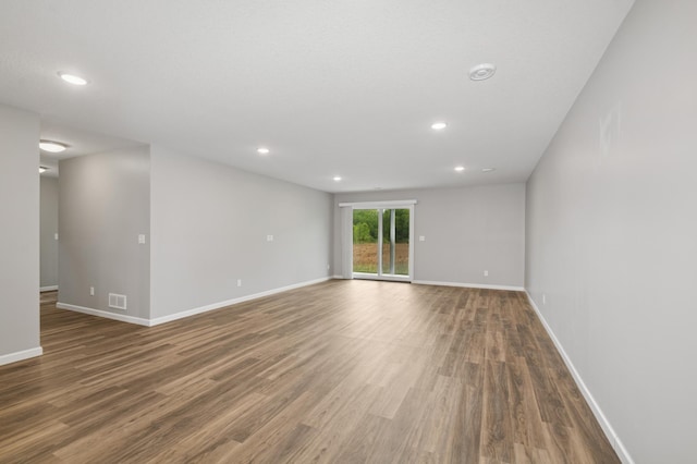 9769 Jeremiah Ct NE, Hanover, MN 55341 - unfurnished room featuring wood finished floors, recessed lighting, and baseboards