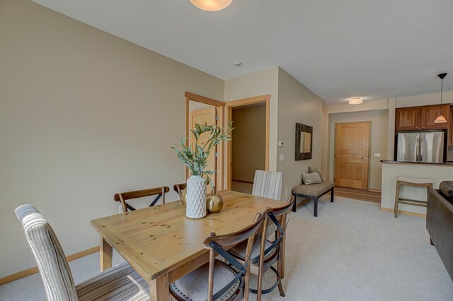 350 Main St N Unit 230, Stillwater, MN 55082 - dining space featuring light carpet and baseboards