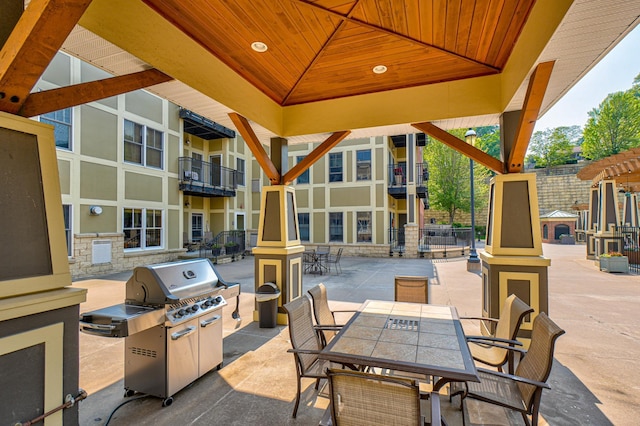 350 Main St N Unit 230, Stillwater, MN 55082 - view of patio / terrace with outdoor dining space and a grill