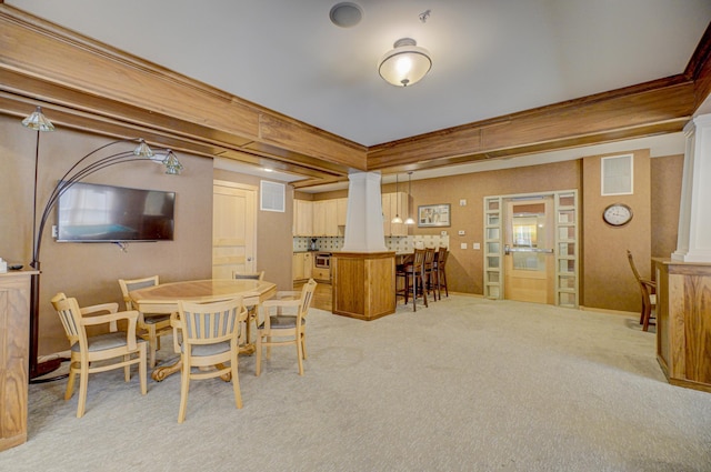 350 Main St N Unit 230, Stillwater, MN 55082 - dining space with ornate columns and light colored carpet
