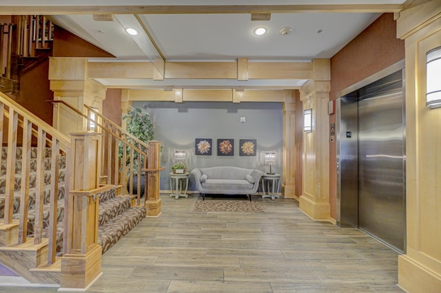 350 Main St N Unit 230, Stillwater, MN 55082 - corridor featuring elevator, stairs, and light wood finished floors