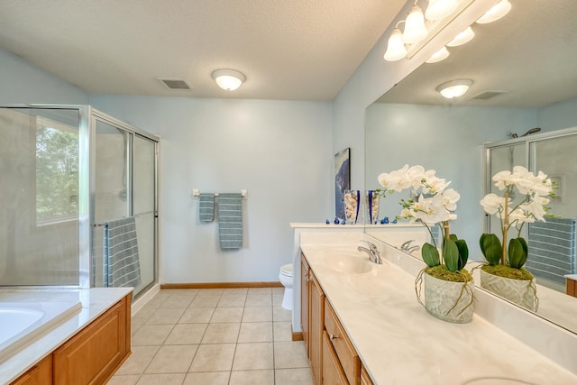 17299 66th Pl N, Maple Grove, MN 55311 - bathroom with double vanity, a shower stall, tile patterned flooring, a bath, and a textured ceiling