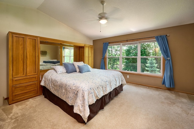 17299 66th Pl N, Maple Grove, MN 55311 - bedroom with light carpet, vaulted ceiling, and ceiling fan