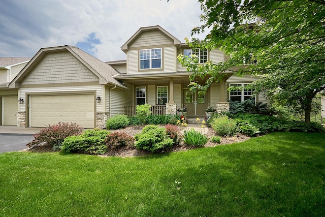 17299 66th Pl N, Maple Grove, MN 55311 - craftsman inspired home featuring covered porch, a garage, a front lawn, and asphalt driveway