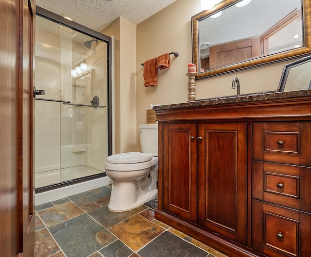17299 66th Pl N, Maple Grove, MN 55311 - full bathroom with a textured ceiling, stone tile floors, a shower stall, and vanity