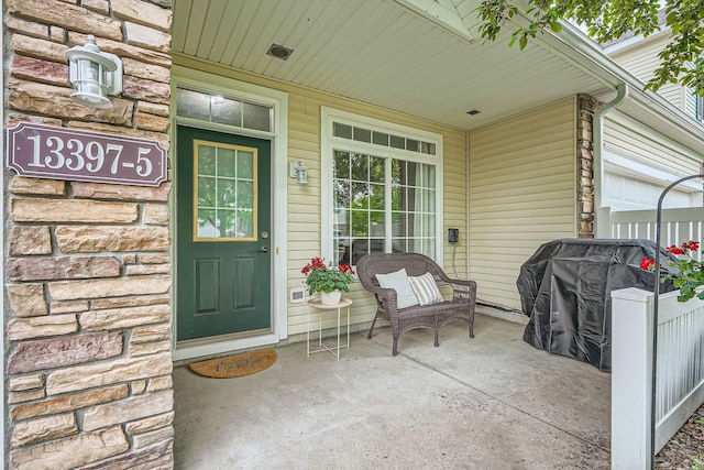 13397 Europa Ct N Unit 5, Hugo, MN 55038 - view of exterior entry featuring covered porch and stone siding
