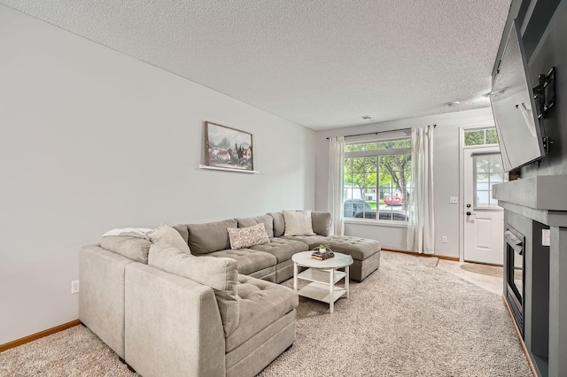 13397 Europa Ct N Unit 5, Hugo, MN 55038 - living area featuring a fireplace, a textured ceiling, light colored carpet, and baseboards