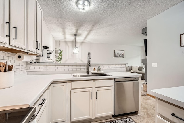 13397 Europa Ct N Unit 5, Hugo, MN 55038 - kitchen with dishwasher, a sink, light countertops, decorative backsplash, and a textured ceiling