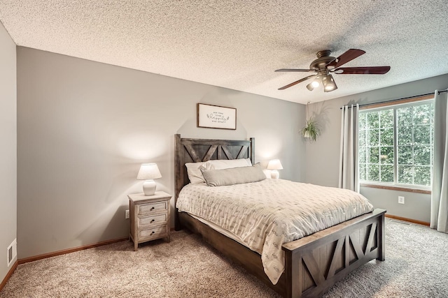 13397 Europa Ct N Unit 5, Hugo, MN 55038 - bedroom featuring light colored carpet, baseboards, ceiling fan, and a textured ceiling