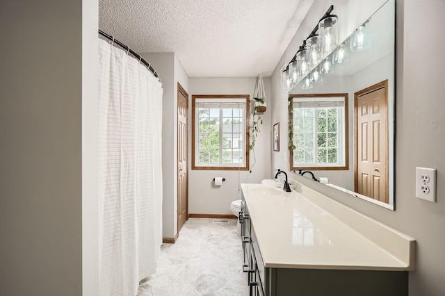 13397 Europa Ct N Unit 5, Hugo, MN 55038 - bathroom with vanity, a textured ceiling, toilet, baseboards, and curtained shower