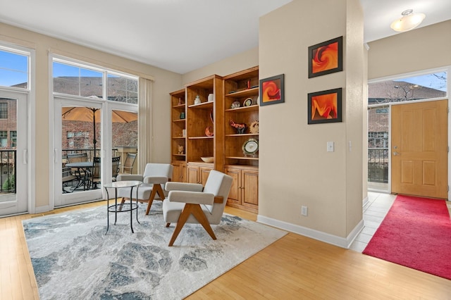 831 River Mews Ct, Minneapolis, MN 55414 - sitting room featuring light wood-type flooring and healthy amount of natural light
