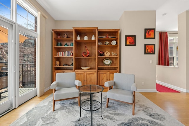 831 River Mews Ct, Minneapolis, MN 55414 - living area with light wood-style flooring and baseboards