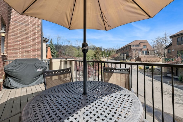 831 River Mews Ct, Minneapolis, MN 55414 - deck featuring outdoor dining area, a grill, and a residential view