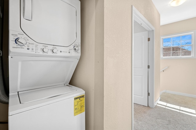 831 River Mews Ct, Minneapolis, MN 55414 - laundry room with stacked washing machine and dryer and carpet floors