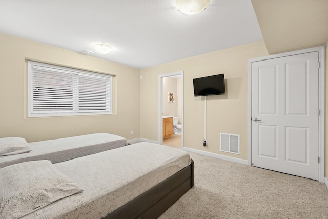 831 River Mews Ct, Minneapolis, MN 55414 - bedroom featuring light carpet and ensuite bath
