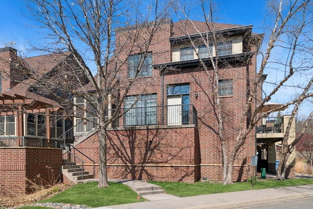 831 River Mews Ct, Minneapolis, MN 55414 - view of side of home featuring brick siding
