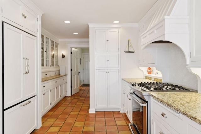 19820 Lakeview Ave, Deephaven, MN 55331 - kitchen featuring stainless steel gas range oven, white cabinetry, decorative backsplash, recessed lighting, and ornamental molding