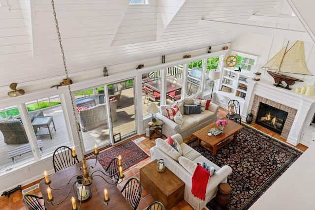 19820 Lakeview Ave, Deephaven, MN 55331 - living area featuring plenty of natural light, high vaulted ceiling, and a brick fireplace