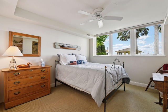 19820 Lakeview Ave, Deephaven, MN 55331 - bedroom with light colored carpet and a ceiling fan