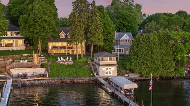 19820 Lakeview Ave, Deephaven, MN 55331 - dock area featuring stairway, a deck with water view, a yard, and boat lift