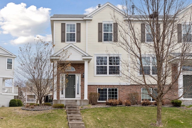 15126 Fanning Dr N, Hugo, MN 55038 - view of property featuring brick siding and a front yard