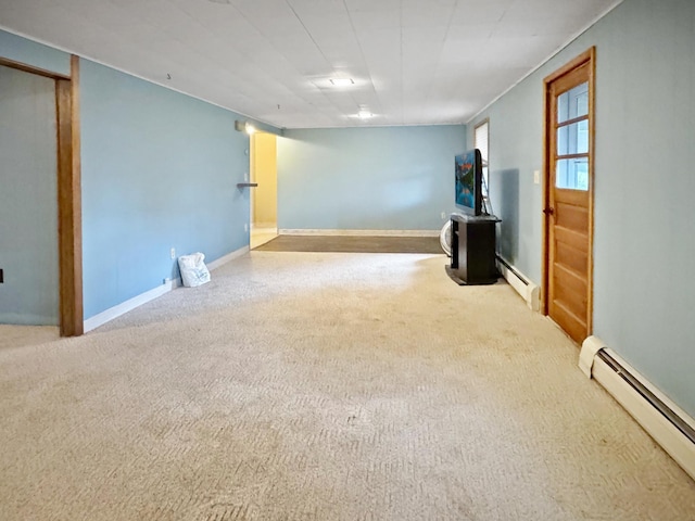 below grade area featuring carpet floors and baseboard heating