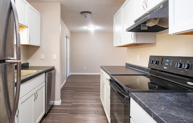 2930 Blaisdell Ave Unit 124, Minneapolis, MN 55408 - kitchen with stainless steel appliances, under cabinet range hood, dark countertops, dark wood-style flooring, and white cabinetry