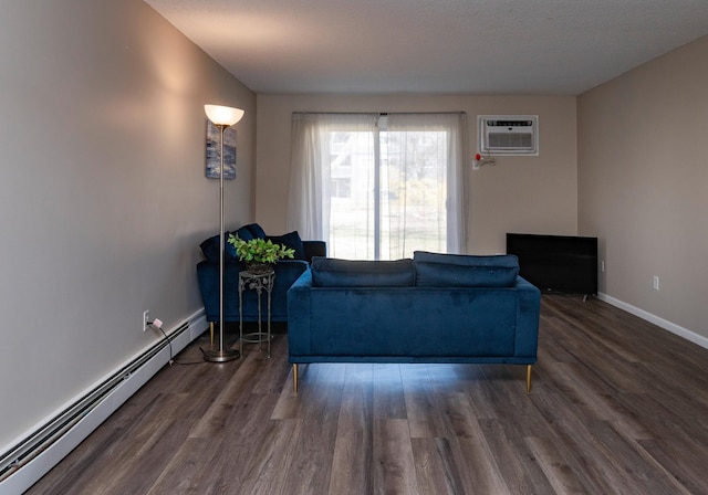 2930 Blaisdell Ave Unit 124, Minneapolis, MN 55408 - living room with a baseboard heating unit, a wall mounted air conditioner, wood finished floors, and baseboards