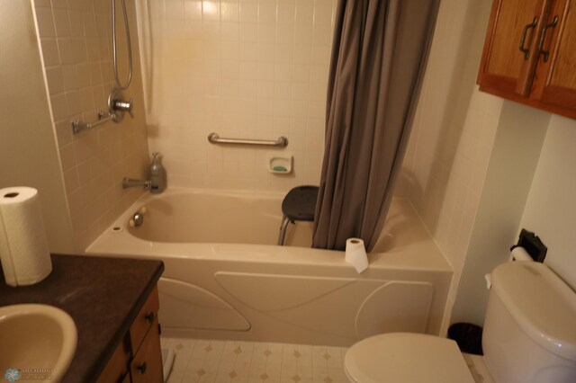 bathroom featuring toilet, tile patterned floors, shower / bathtub combination with curtain, and vanity