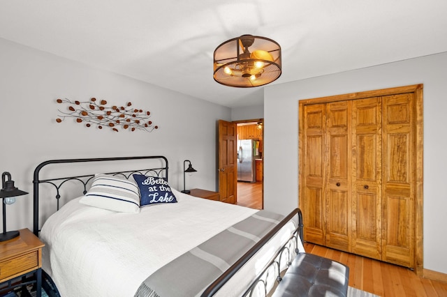 12742 Lake Miltona Dr NE, Miltona, MN 56354 - bedroom with stainless steel fridge and light wood finished floors