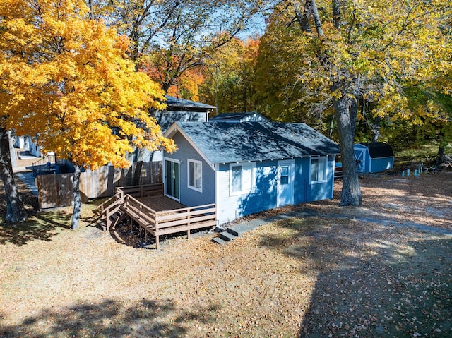 12742 Lake Miltona Dr NE, Miltona, MN 56354 - view of front of home with a deck and roof with shingles