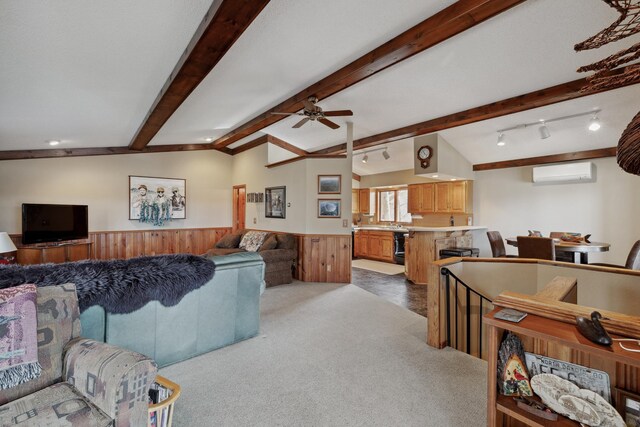 12037 Northgate Ln, Crosslake, MN 56442 - carpeted living area featuring a wall mounted air conditioner, wainscoting, a ceiling fan, and beam ceiling