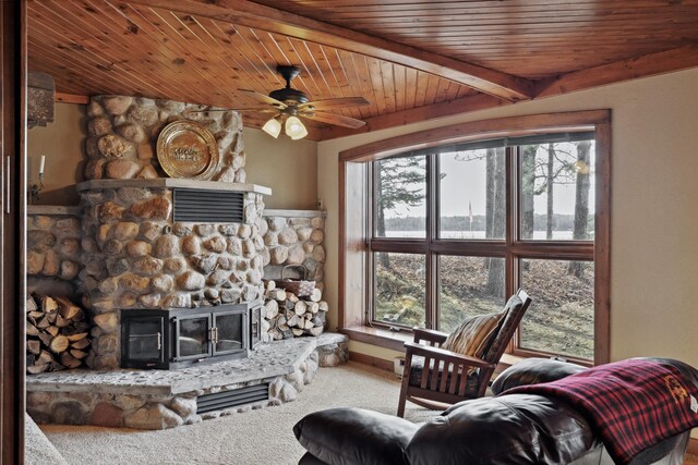 12037 Northgate Ln, Crosslake, MN 56442 - living area featuring carpet flooring, a fireplace, wood ceiling, ceiling fan, and beamed ceiling