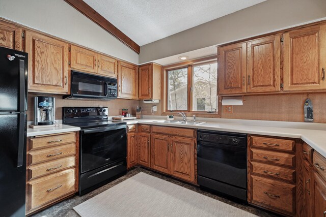 12037 Northgate Ln, Crosslake, MN 56442 - kitchen with black appliances, a sink, vaulted ceiling, light countertops, and brown cabinets