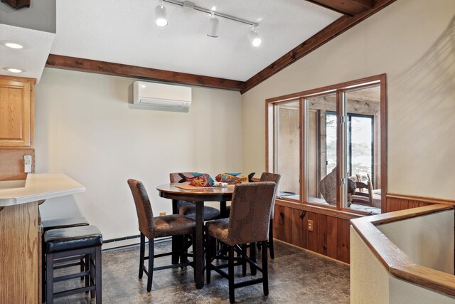 12037 Northgate Ln, Crosslake, MN 56442 - dining area with lofted ceiling, a wall unit AC, and recessed lighting