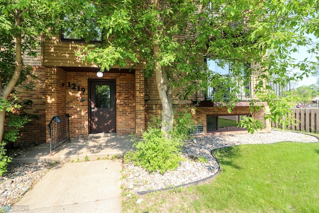 1219 7th St S Unit 1, Moorhead, MN 56560 - property entrance featuring brick siding and a patio area